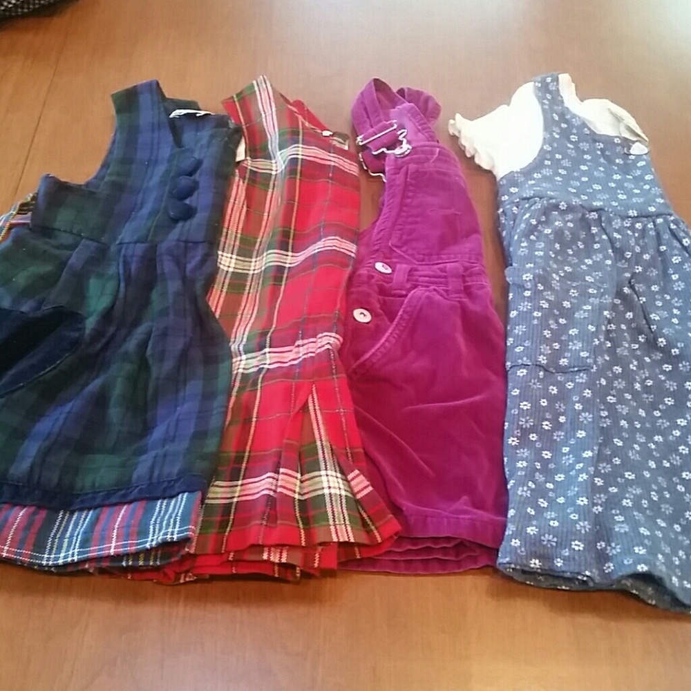 Bundle of 4 little girls' jumper style dresses